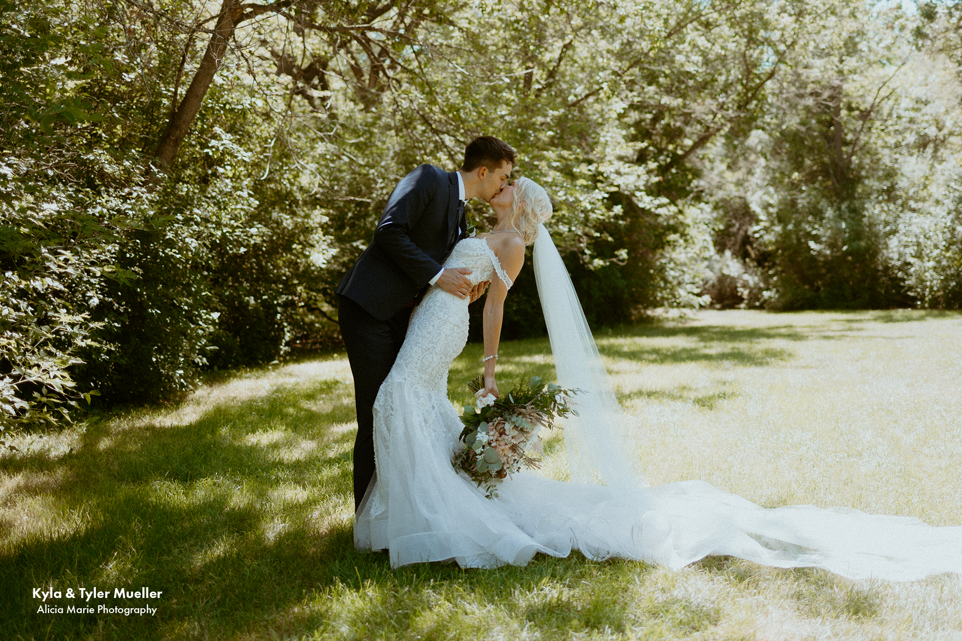 bride and groom kissing after a wedding