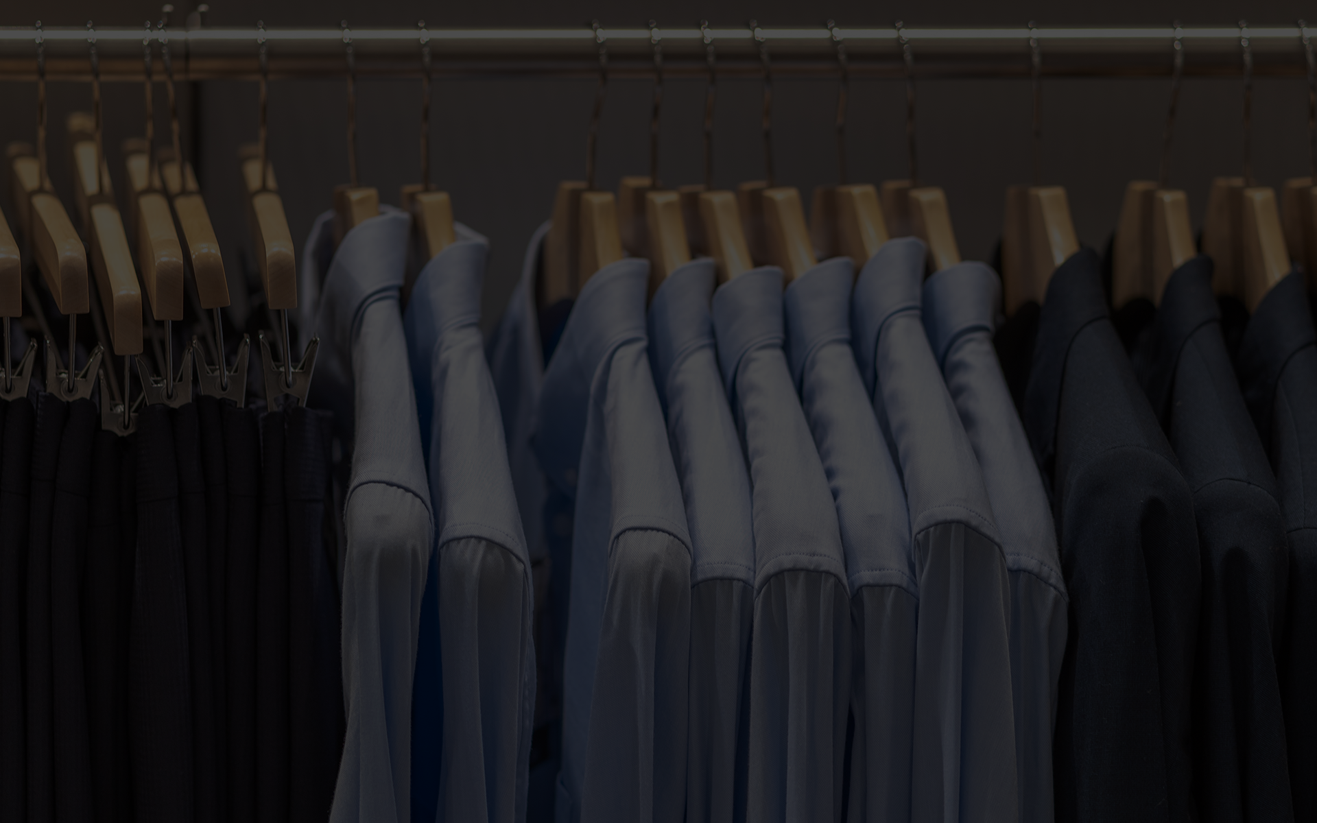 clothing hanging at a dry cleaner after dry cleaning