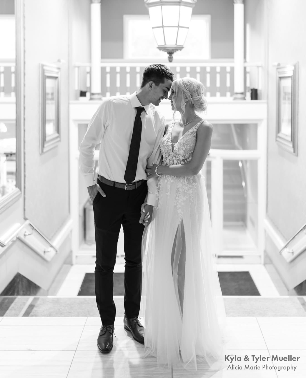 bride and groom at the top of stairs